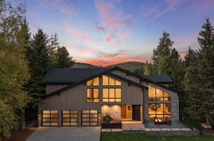 View of front of house featuring a garage and a mountain view