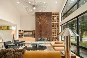 Living room with a towering ceiling and plenty of natural light