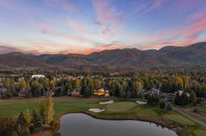 Property view of mountains featuring a water view