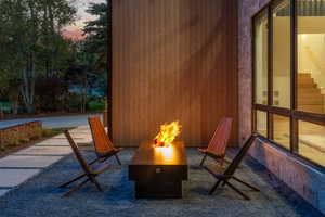 Patio terrace at dusk featuring a fire pit