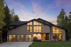 Modern home with a lawn and a garage