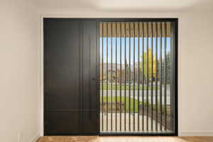 Doorway featuring light wood-type flooring and a wealth of natural light