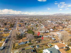 Birds eye view of property with a mountain view