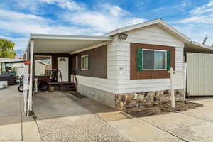 View of home's exterior with a carport