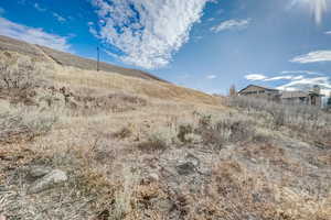 Property view of mountains with a rural view