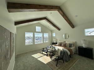 Carpeted bedroom with lofted ceiling with beams, multiple windows, and a textured ceiling