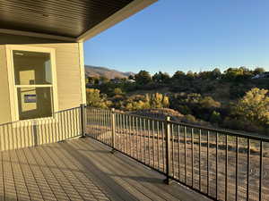 Covered Deck with a mountain & gully view