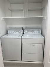 Laundry area featuring washing machine and clothes dryer