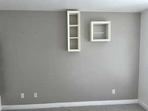 Empty room featuring carpet floors