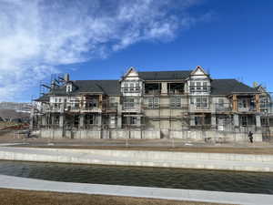 Rear view of property featuring a water view