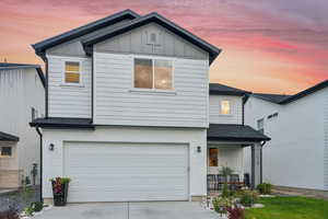 View of front of home featuring a garage