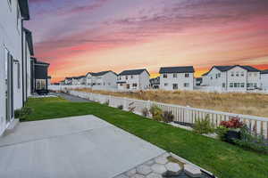 Yard at dusk with a patio