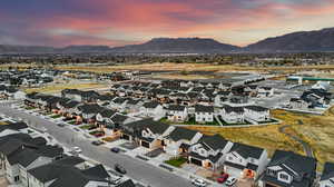 Aerial view at dusk featuring a mountain view