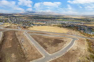 Birds eye view of property with a mountain view