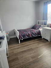 Bedroom featuring dark wood-type flooring