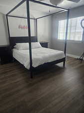 Bedroom featuring ceiling fan and dark hardwood / wood-style flooring