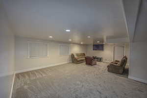 Sitting room featuring light carpet