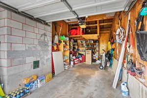 View of garage and lots of room for storage