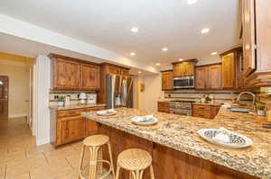 Breakfast bar featuring granite countertops