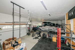 6 car garage with car lift that makes parking and storing up to 7 cars easy