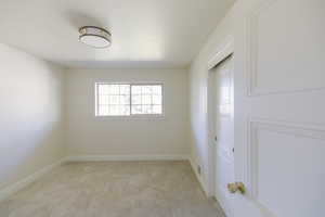 Spare room with light carpet