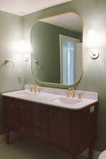 Bathroom featuring tile patterned flooring and vanity