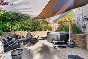 View of patio featuring a hot tub