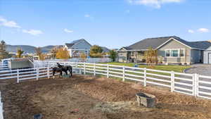 Upgraded vinyl fencing currently set up for horses or other animals; this space could be used for an expanded garden space