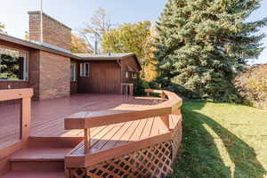 Deck featuring a lawn