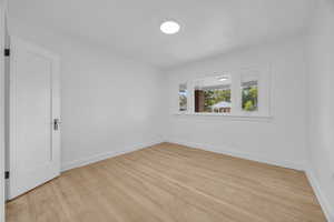 Spare room with light hardwood / wood-style floors