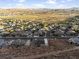 Birds eye view of property with a mountain view