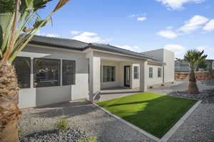 Rear view of property with a patio