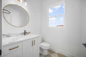 Bathroom featuring toilet and vanity