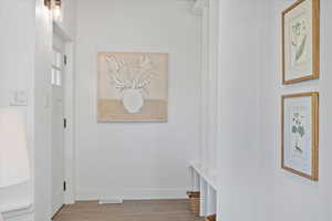 Corridor with wood-type flooring