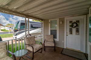 Spacious front porch, access to front door and family room