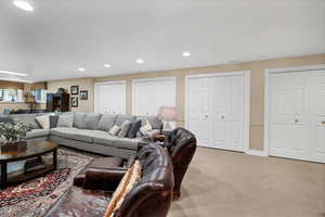 Basement Living area featuring with fireplace and sitting area