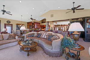 Living room featuring, high vaulted ceiling, ceiling fan, and view of Pine Valley Mountains