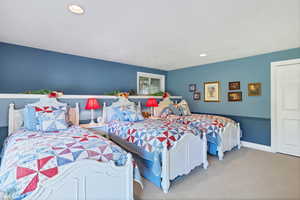 Adorable kids bedroom featuring French doors, a textured ceiling, and access to exterior