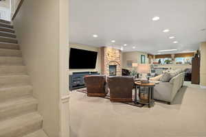 Basement Living area featuring with fireplace and sitting area