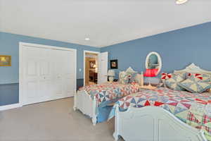 Adorable kids bedroom featuring French doors, a textured ceiling, and access to exterior