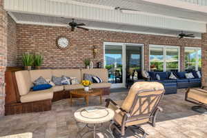 View of pool patio / terrace with ceiling fan and outdoor lounge area