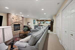 Basement Living area featuring with fireplace and sitting area