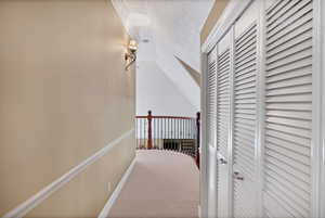 Hallway to upper bedrooms and sitting area