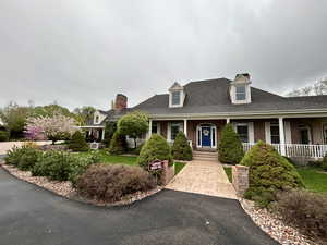 Cape cod house with covered porch