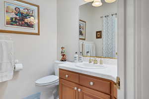 Bathroom with vanity off bedroom