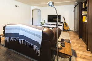 Living room with hardwood / wood-style flooring