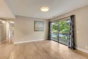 Empty room with light wood-type flooring