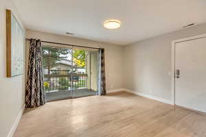 Spare room featuring light hardwood / wood-style flooring