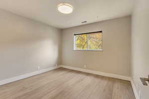 Spare room featuring light hardwood / wood-style floors