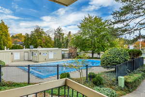 View of pool and mountains from balcony